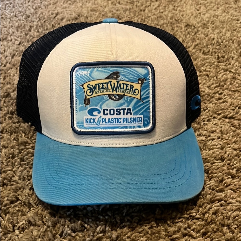 SweetWater Brewing Costa Del Mar Blue and Black Trucker Hat.